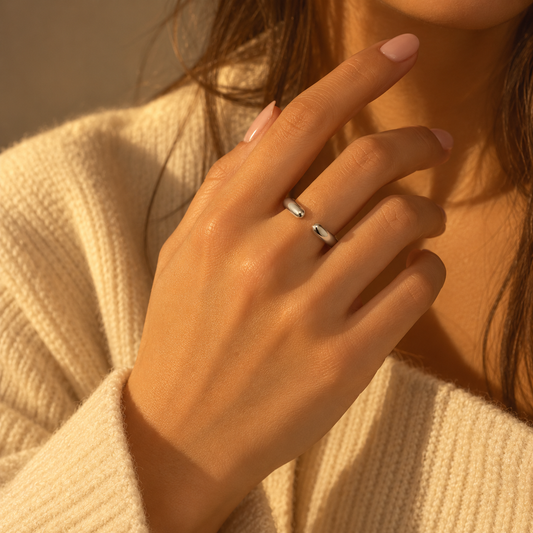 Dainty Double Drip Ring worn on a hand, showing the two rounded ends of its open band.