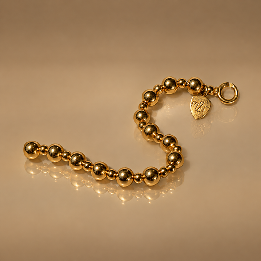 Milk & Rose Beaded Bracelet - gold bead bracelet with graduated beads and heart tag
