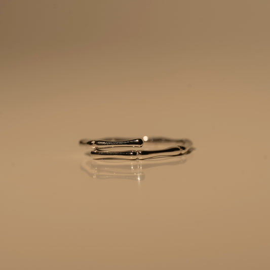 Milk & Rose Dainty Bamboo Ring with a slim open band and bamboo-inspired texture, shown from the side.
