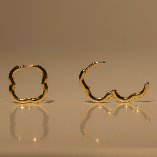 Milk & Rose Fleur Hoops in a gold tone, showing scalloped flower outlines from the front and side.