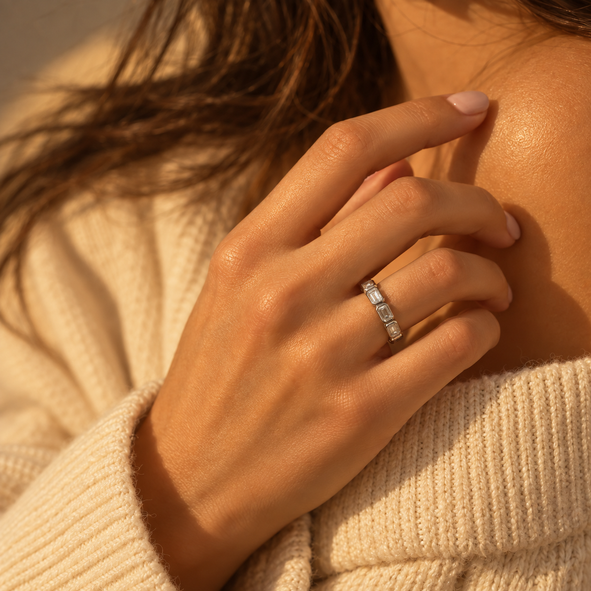 Milk & Rose Windows Ring worn on a hand beside a cream knit sweater, showing its silver-tone band and rectangular clear details.