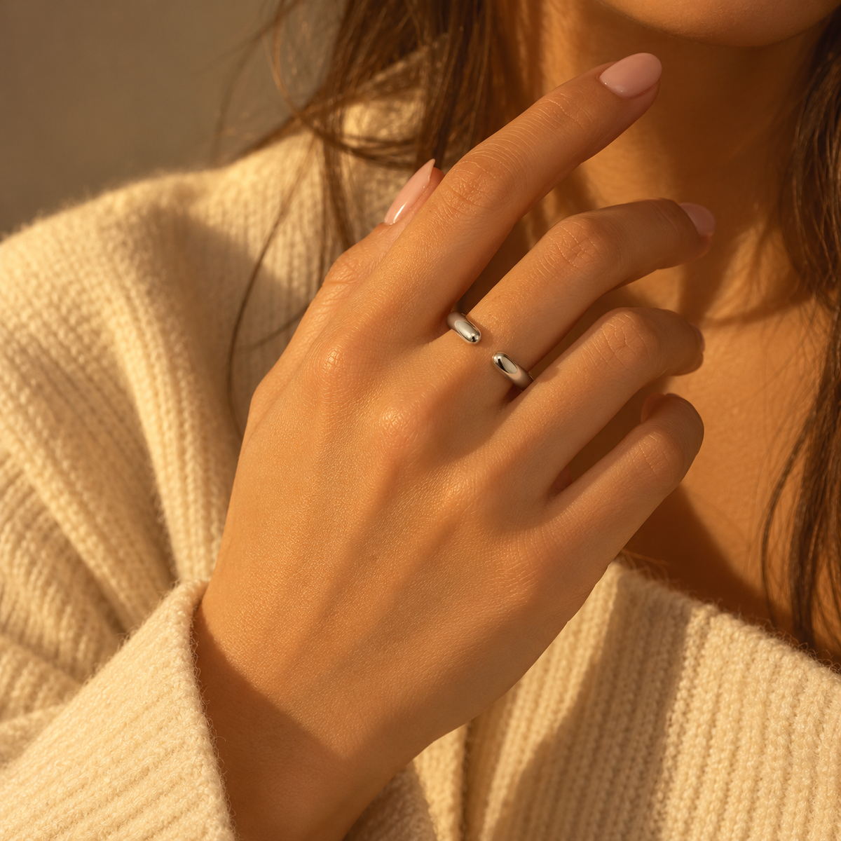 Dainty Double Drip Ring worn on a hand, showing the two rounded ends of its open band.