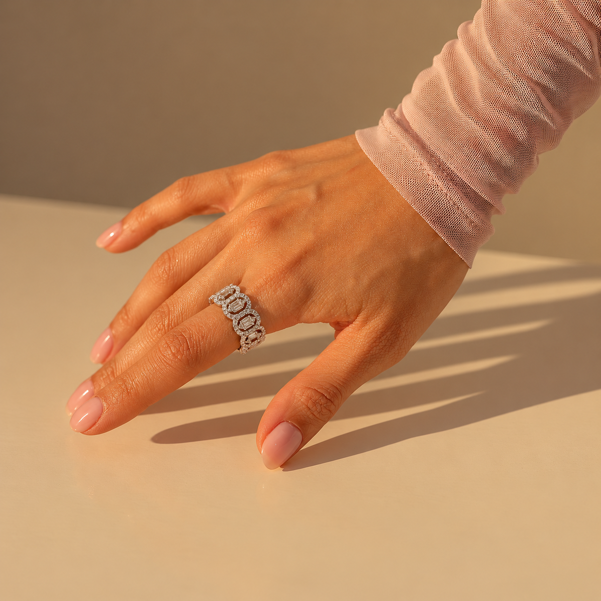 Milk & Rose Super Glam Ring worn on a hand in sunlight, showing its wide oval-link design and clear stones.